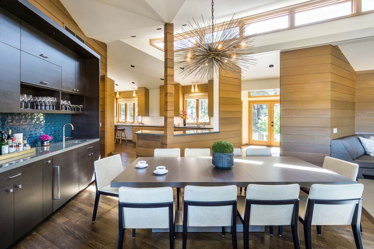 luxury kitchen and dining room with stunning light fixture