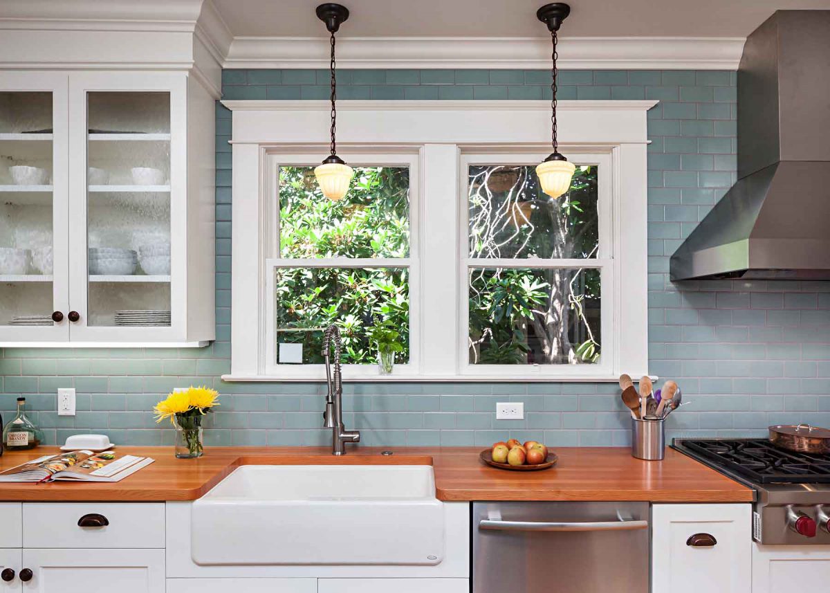 Portland Kitchen Remodel with white cabinets and trim and teal backsplash