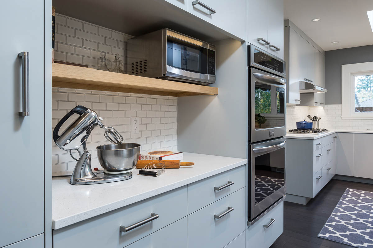 baby blue kitchen cabinets with white tile backsplash in luxury kitchen