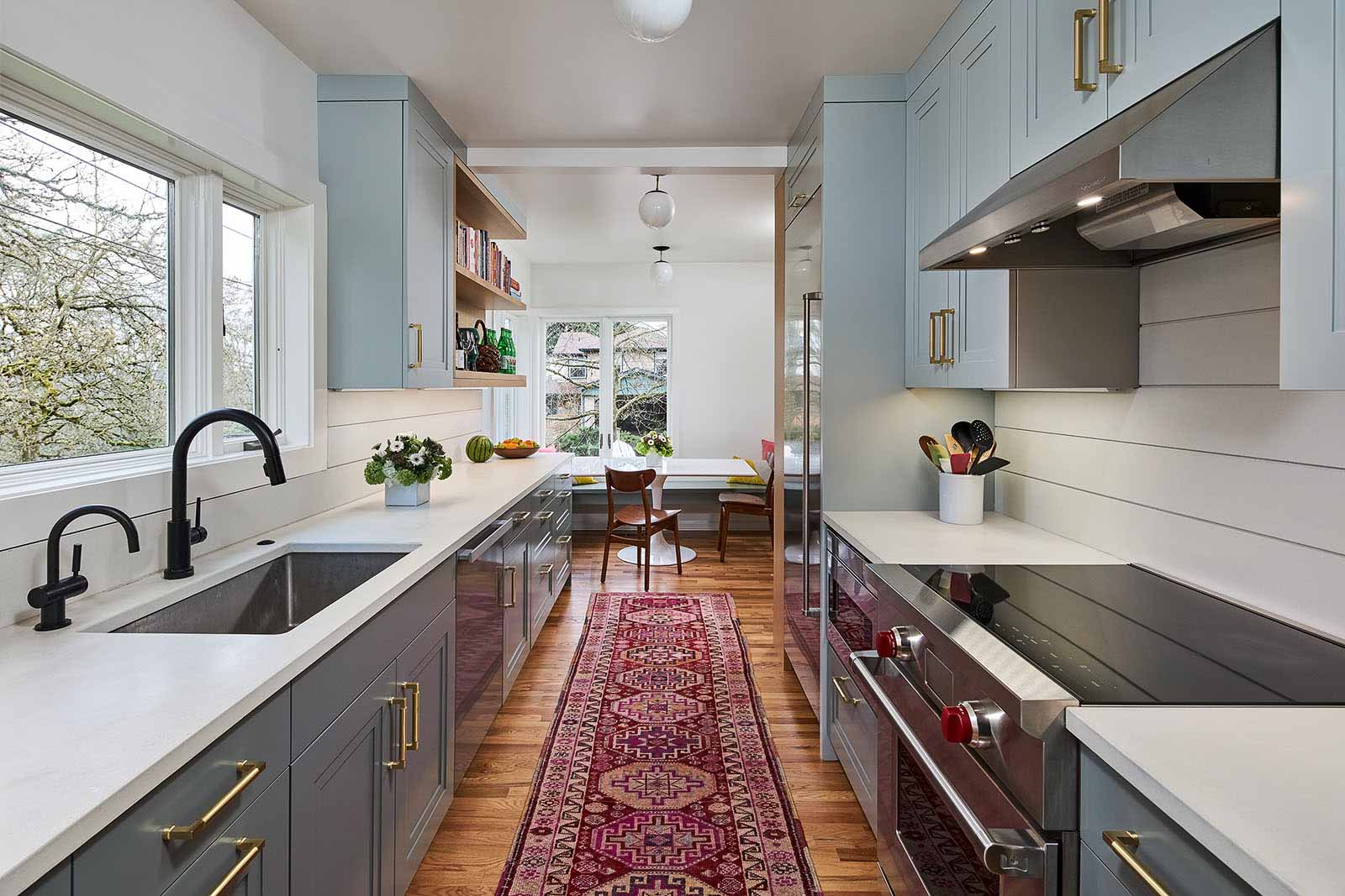 hamish murray kitchen with white countertops, grey cabinets, and gold hardware