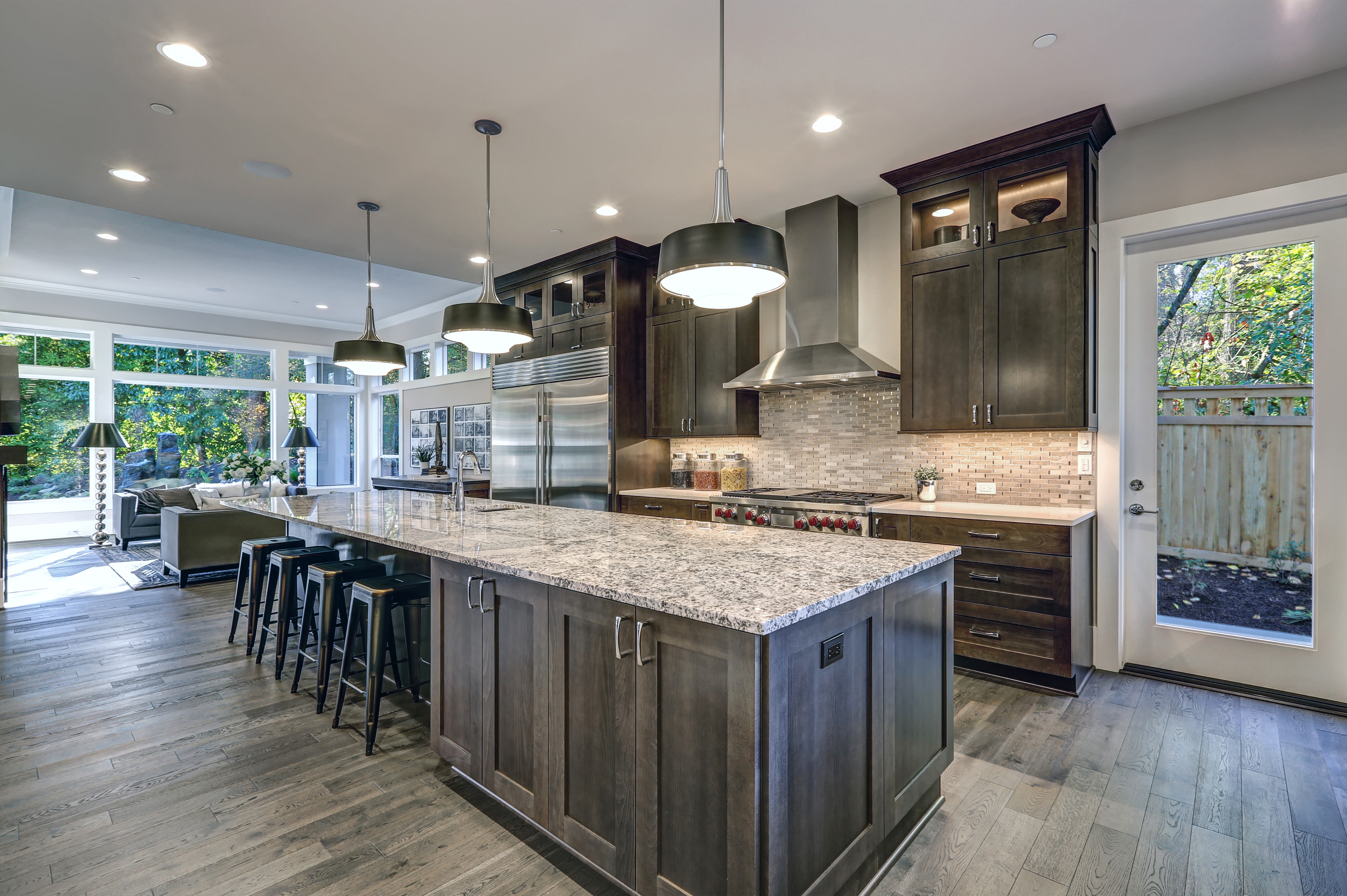 beautiful remodeled kitchen with granite countertop and wooden cabinets