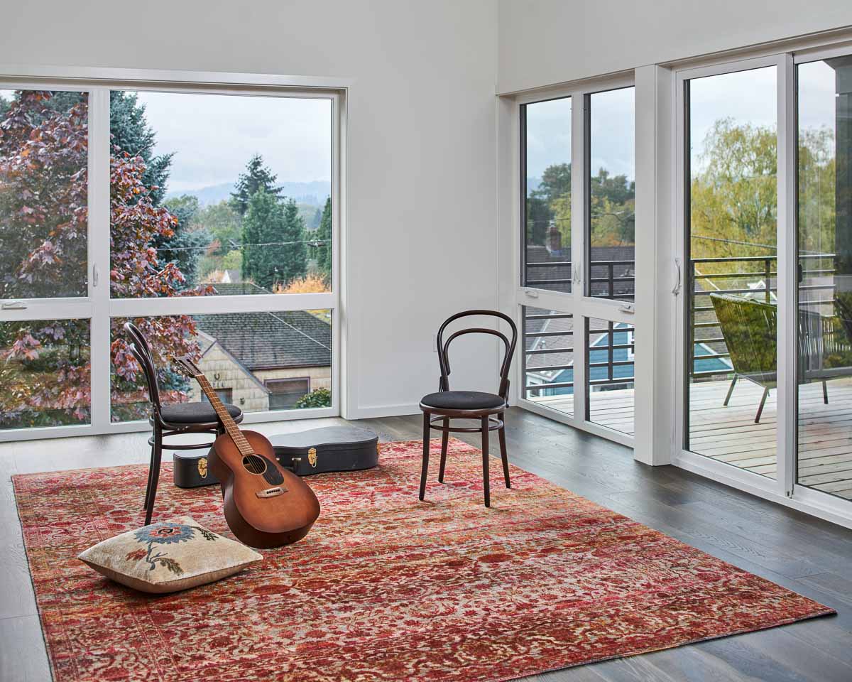 living room with lots of big windows and natural lights and a great view of the neighborhood in portland, oregon