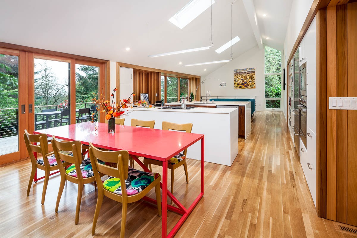 Bright Modern Dining Room with vaulted ceilings and skylights by Architect Paul McKean
